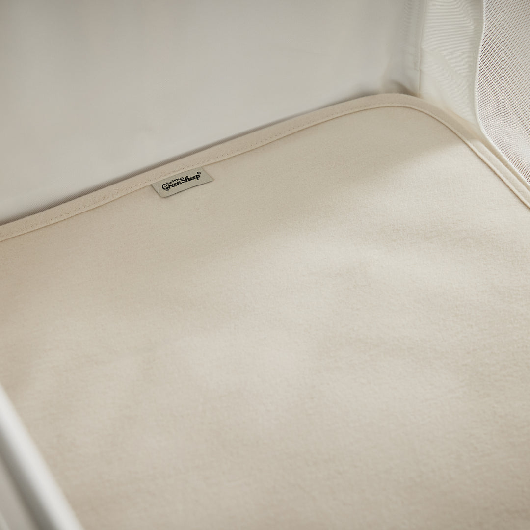 Органічний наматрацник для дитячого ліжечка