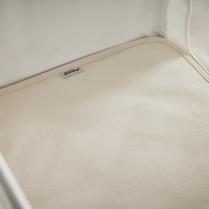 Органічний наматрацник для дитячого ліжечка