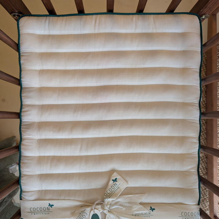 Madrasbeskytter i kapok og økologisk bomuld til tremmeseng, 40 x 90 cm